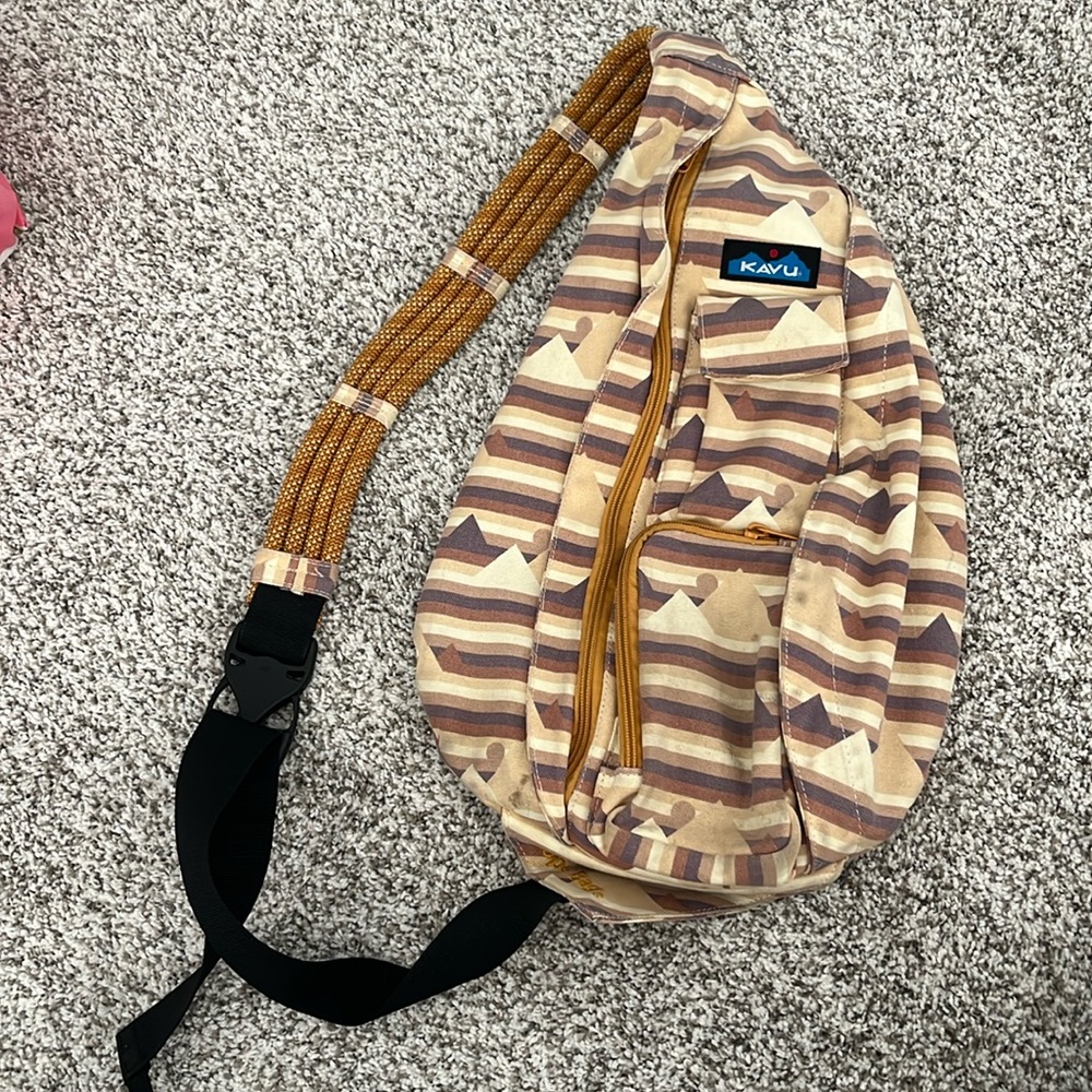 Kavu sling backpack. Very well loved! But would clean easily 🤩😃